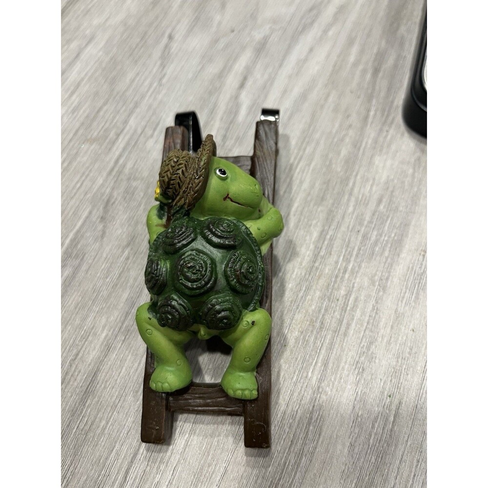 Flower Pot Hugger, Turtle Wearing A Straw Hat On A Ladder